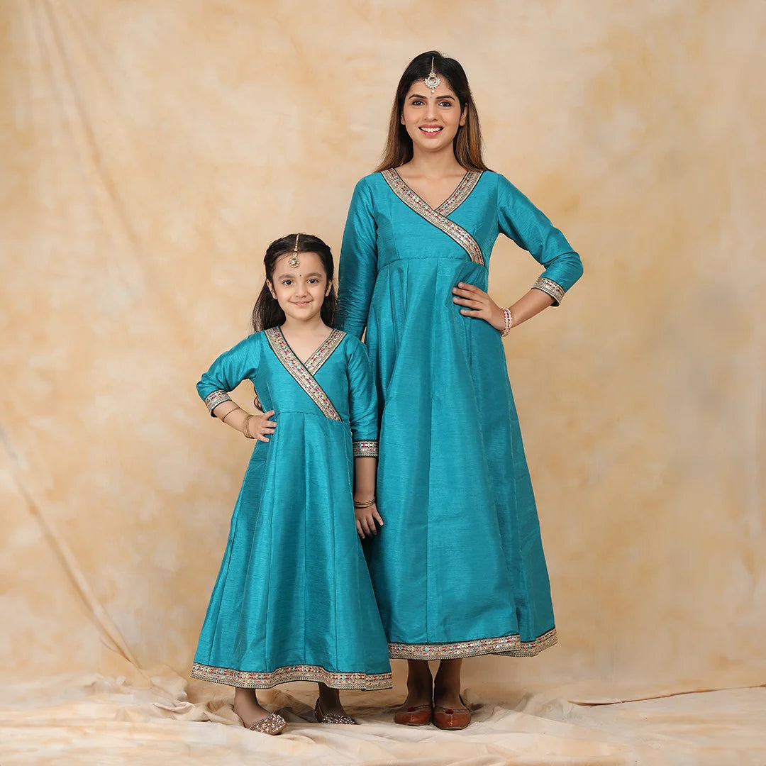 Exquisite Peacock Blue Ethnic Silk Gown Set for Mom and Daughter Perfectly Coordinated Twin Outfits