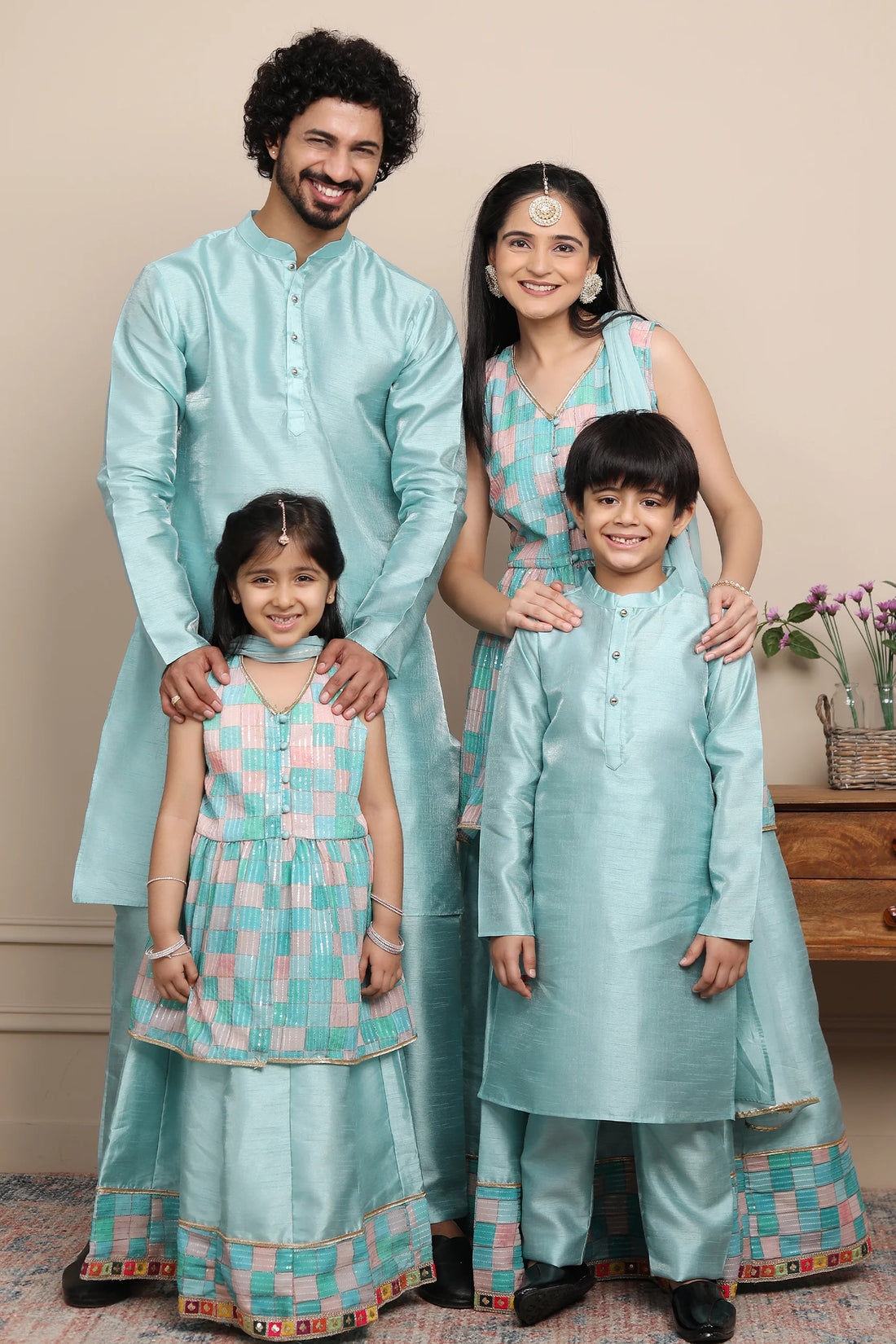 Shining Aqua Blue Lehenga and Peplum Top Set With Matching Kurta Pyjama for Family