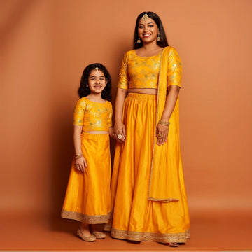 Amber Yellow Brocade Top With Amber Lehenga For Mom And Daughter
