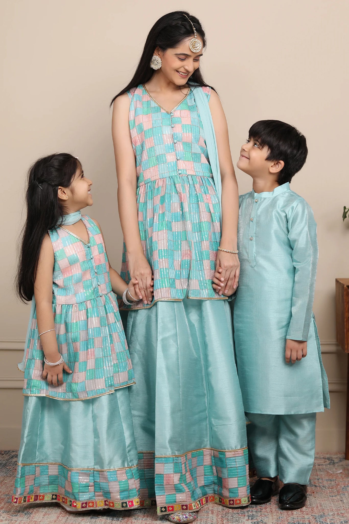 Shining Aqua Blue Lehenga and Peplum Top Set With Matching Kurta Pyjama for Family